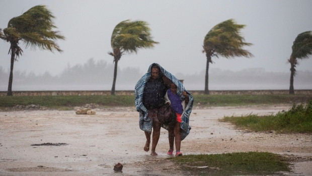 Hurricane Irma battered Cuba on Saturday with deafening winds and unremitting rain, pushing seawater inland and flooding homes.