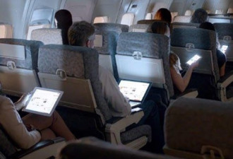 大陆解除飞机用手机禁令 交航空公司决定