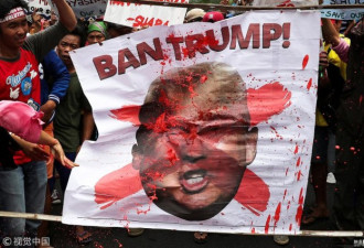 菲律宾民众示威抗议特朗普到访 泼画像燃料