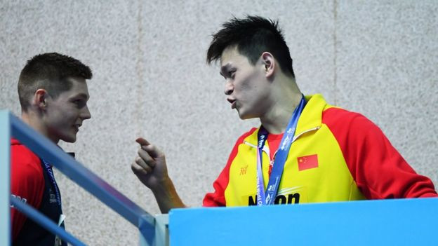 Sun Yang (R) of China speaks with Duncan Scott of Great Britain during the medal ceremony for the Men"s 200m Freestyle Final on day three of the Gwangju 2019 FINA World Championships at Nambu International Aquatics Centre on July 23, 2019 in Gwangju, South Korea.