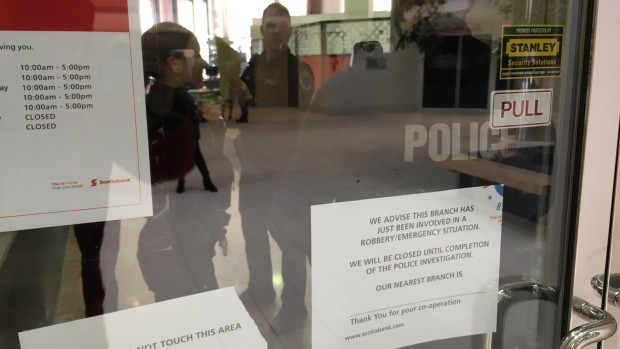 As many as eight RNC officers were on scene at the Scotiabank on Water Street in St. John's, speaking with witnesses and collecting evidence following a report of an armed robbery.