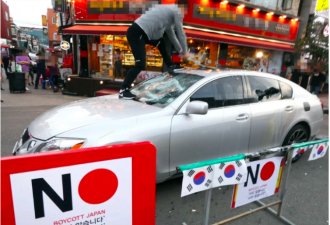韩国抵制日货疯狂：砸日系车倒日本酒骂日政府