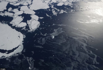 美国拍到神奇画面 南极冰山被蓝色光环包围