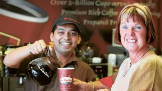Jeri Lynn Horton-Joyce, daughter of Tim Horton, is served in the Shaikh Zayed Road location in Dubai. This photo was taken for a story published in the Gulf News, a daily English language newspaper in Dubai.