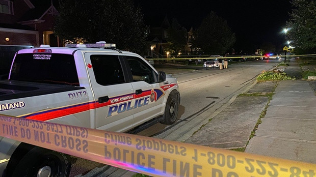 Police vehicles are seen on Coulter Street in Newmarket after a shooting that left a male dead on Oct. 4, 2019. (John Hanley)