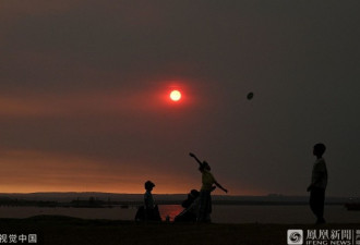 山火持续蔓延 悉尼上空连太阳都“变色”了