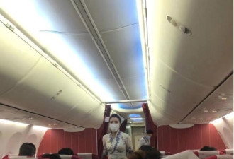 国内外多机场出入境测体温 飞机上人人戴口罩