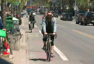 多伦多敦促增加自行车道！而车店老板却担心