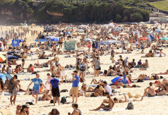 澳洲新南威尔士州疫情恶化 海滩人山人海