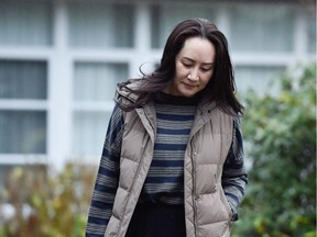 Huawei Technologies Chief Financial Officer Meng Wanzhou leaves her home to attend a court hearing in Vancouver, British Columbia, Canada December 7, 2020. REUTERS/Jennifer Gauthier/File Photo