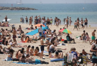 以色列解除户外戴口罩禁令 再向正常化迈进