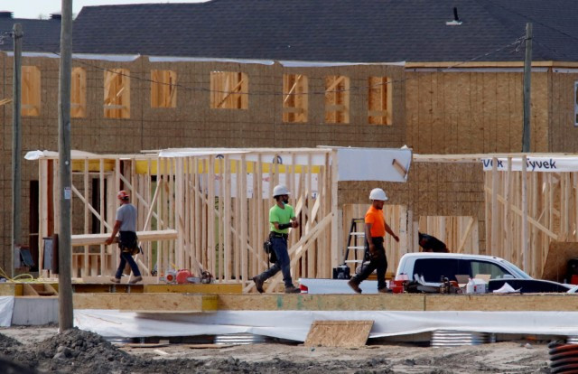 Construction workers work on new homes in Ottawa, Ontario, Canada, May 27, 2021. REUTERS/Patrick Doyle