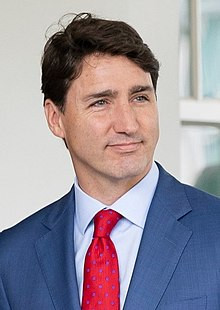 Photograph of Trudeau smiling in front of the White House, Washington, D.C.