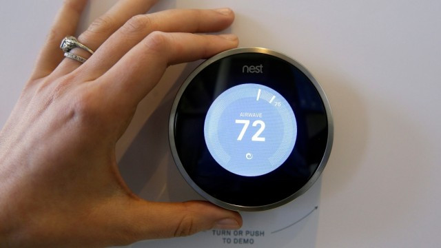 The Nest thermostat is on display following a news conference Wednesday, June 17, 2015, in San Francisco. (AP Photo/Eric Risberg)