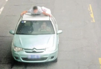 丈夫挂在车顶，华人女司机开上高速公路