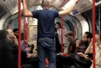 伦敦地铁男子欲对女子动粗 几名英国人立即起身将其制服…