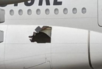 飞机半空中突传爆炸声 破个大洞乘客吓尿