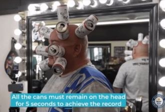 男子脸上吸10个易拉罐 创吉尼斯世界纪录