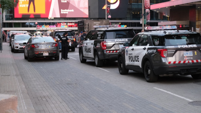 Police respond to a shooting near York Street and Bremner Boulevard Saturday July 16, 2022. (Simon Sheehan /CP24)