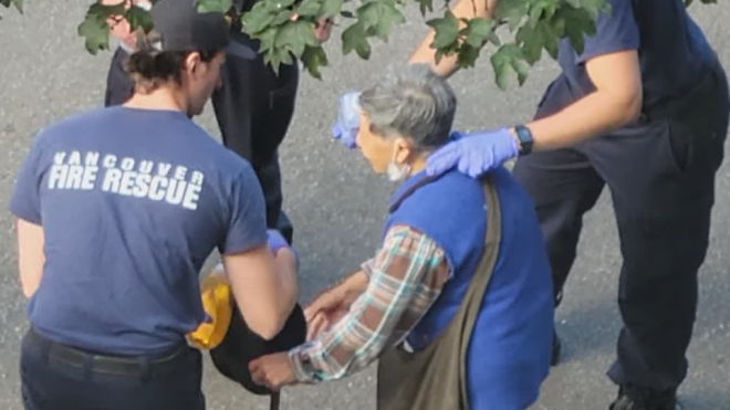 This screengrab from a video posted to YouTube shows first responders tending to a senior in Vancouver. Police have said she needed to be decontaminated after being bear sprayed on Monday, July 18, 2022. 