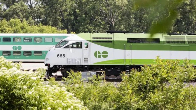 A GO train parked in a train yard