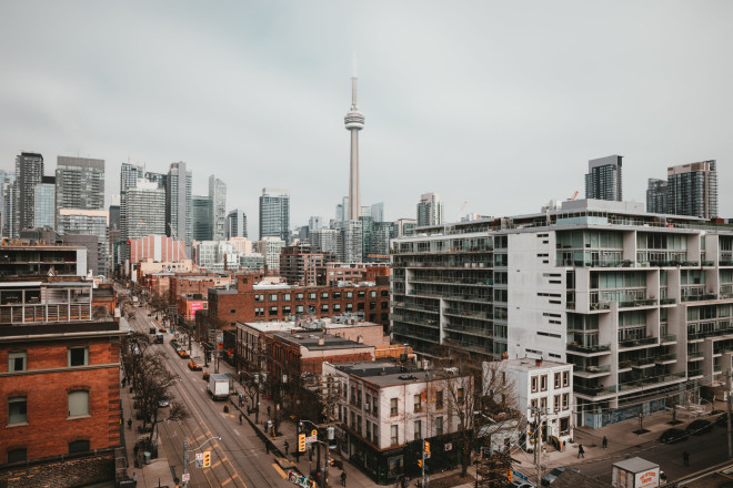 The Toronto CN tower emerges from the urban skyline, image by Matthew Henry