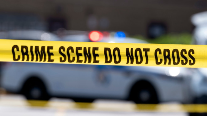 Yellow crime tape blocks off an area on Tuesday, July 13, 2021, in Baltimore, Md. (AP Photo/Jose Luis Magana)
