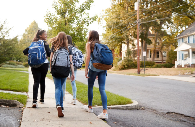 Teen girls walking to school
