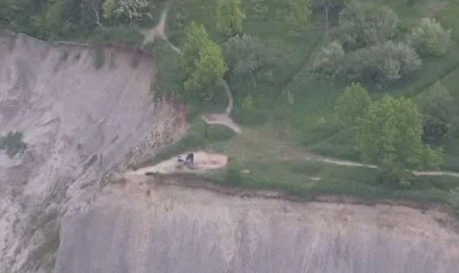 Residents are seen near the edge of the Scarborough Bluffs in this file photo.