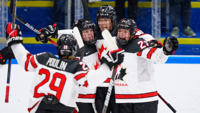 The players of Canada celebrate after Brianne Jenner has scored their second goal during The IIHF World Championship Woman's ice hockey gold medal match between USA and Canada in Herning, Denmark, Sunday, Sept. 4, 2022.. (Bo Amstrup/Ritzau Scanpix via AP)