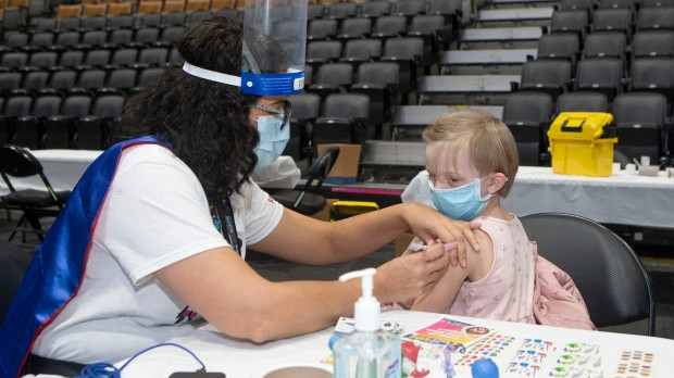 Child getting COVID-19 vaccine