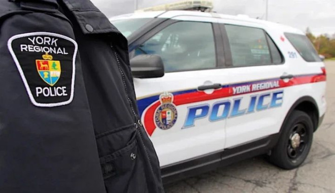 A York Regional Police officer and cruiser.