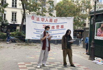 街头举行表演 海外华人庆祝习近平“登基”