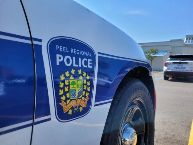 The Peel Regional Police badge is seen on the side of a car in this file photo.