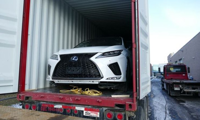 White Lexus in a shipping container