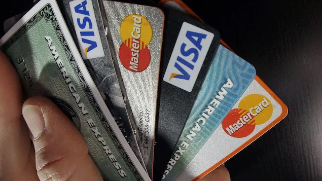 Several credit cards in one hand.