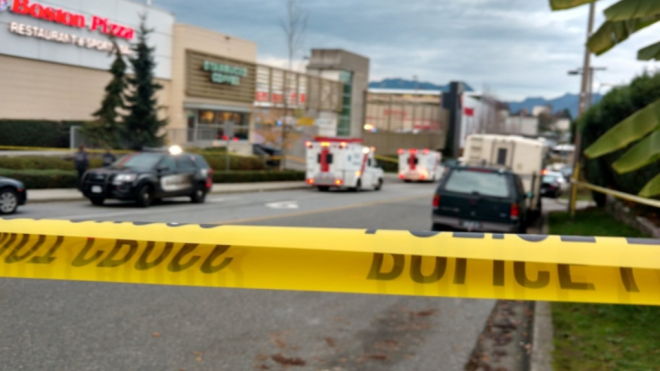 Police tape blocks the scene of a stabbing and shooting at a Canadian Tire on Bentall Street, Thursday, Nov. 10, 2016. (Ben Miljure)