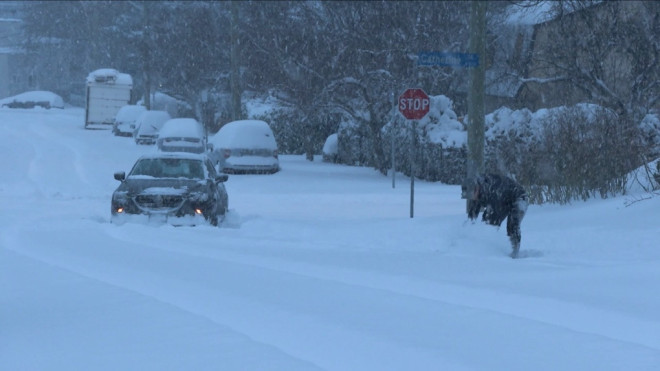 Victoria residents dig out of their homes as heavy snow falls on Vancouver Island on Dec. 20, 2022. (CTV News)