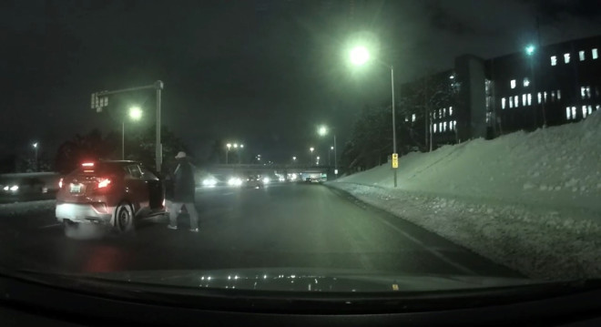 A still image from a carjacking on Riverside Drive Sunday night that was caught on dashcam footage.