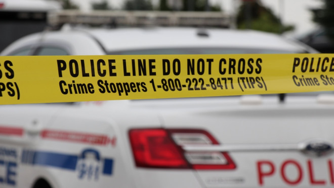 Police tape is seen in front of a Durham Regional Police cruiser. (Durham Regional Police) 