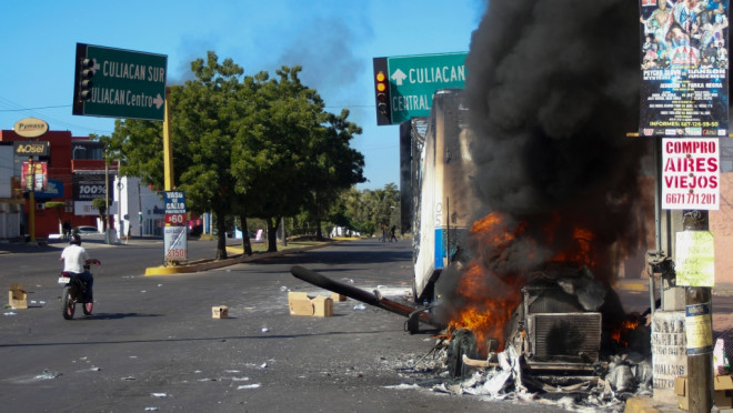 A truck burns after being set on fire on a street in Culiacan, Sinaloa state, Thursday, Jan. 5, 2023. Mexican security forces captured Ovidio Guzmán, an alleged drug trafficker wanted by the United States and one of the sons of former Sinaloa cartel boss Joaquín “El Chapo” Guzmán, in a pre-dawn operation Thursday that set off gunfights and roadblocks across the western state’s capital. (AP Photo/Martin Urista)