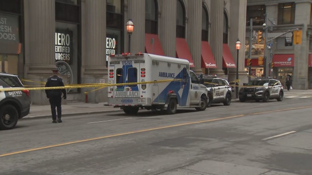 Toronto police are investigating after a woman died when she was pushed while walking downtown.
