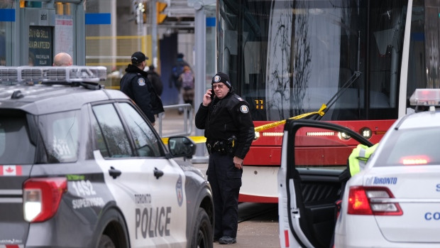 Police are pictured at Spadina and Sussex avenues after a woman was stabbed on board a streetcar in downtown Toronto Tuesday, January 24, 2023. (Simon Sheehan/CP24)