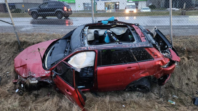 A totaled Range Rover is seen in a ditch near the QEW in Grimsby, Ont. following a crash on Feb. 9, 2023. (OPP Highway Safety Division)