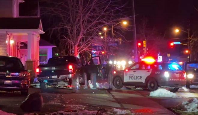 Crews take a driver into custody after a collision in Scarborough on Feb. 10, 2023.