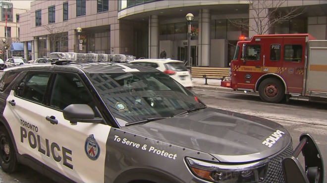 Emergency vehicles are pictured outside of Metro Hall downtown after a suspicious package was discovered Friday, February 17, 2023.