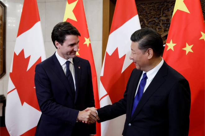 Prime Minister Justin Trudeau shakes hands with President Xi Jinping