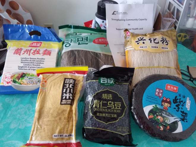 A picture containing text, indoor, items, cluttered Description automatically generated