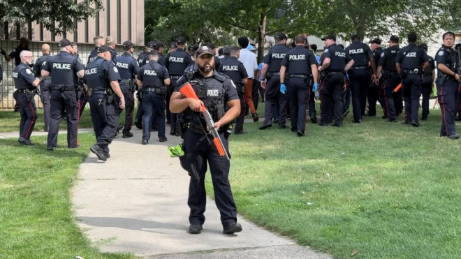 Toronto police attend the scene of what they say was a "demonstration turned violent" at a park on Aug. 5, 2023. (Phil Fraboni) 