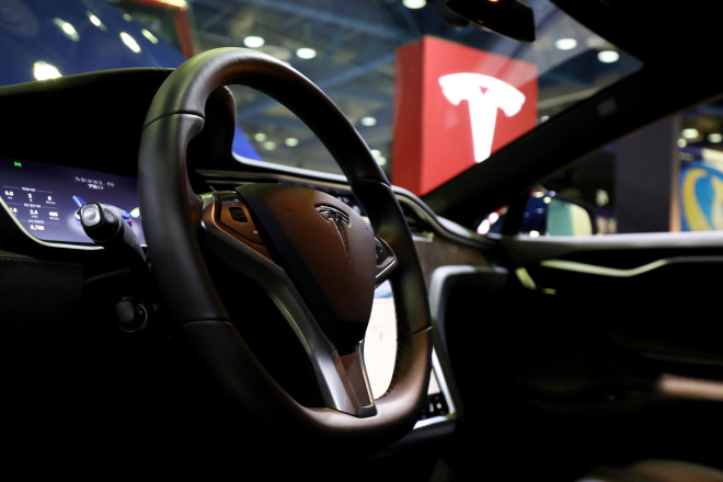 Tesla Hacker Proves a Way of Unlocking Doors, Starting Engine - Bloomberg